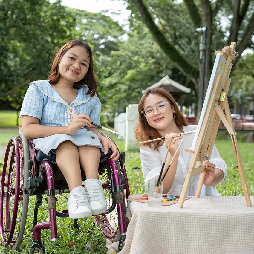 Friends spending time together during an outdoor community activity.